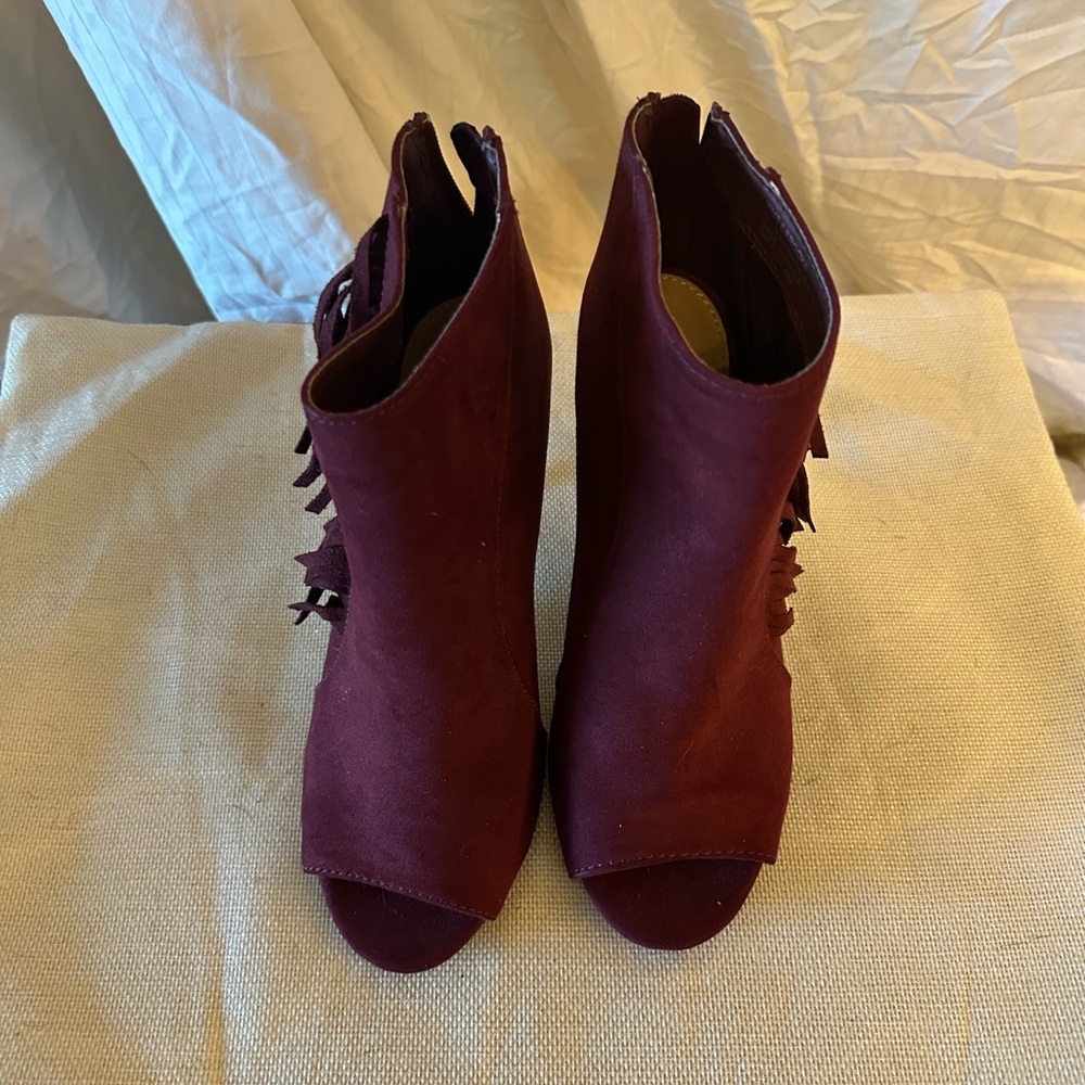 Heeled peep toe booties with fringe